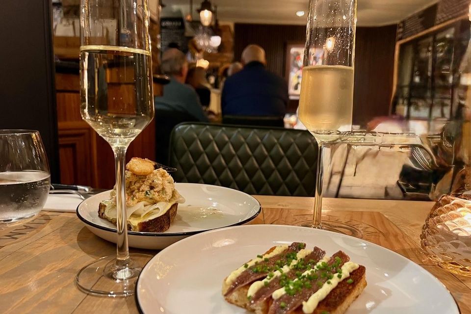 Cantabrian anchovies on butter brioche toast, front, and Lambay crab meat on toast, crab claw and kohlrabi. Photo: Lucinda O’Sullivan